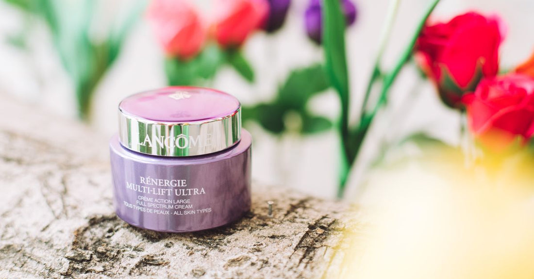 A flatlay of anti-ageing night cream jars and serums on a marble surface, representing the best anti ageing night cream UK selection.