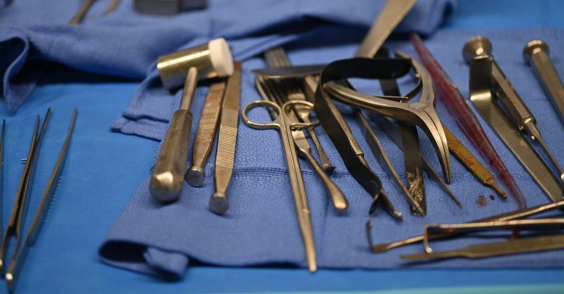A flatlay of stainless steel ingrown toenail tools including clippers, lifters, and files on a white surface, showing how to choose the right set.