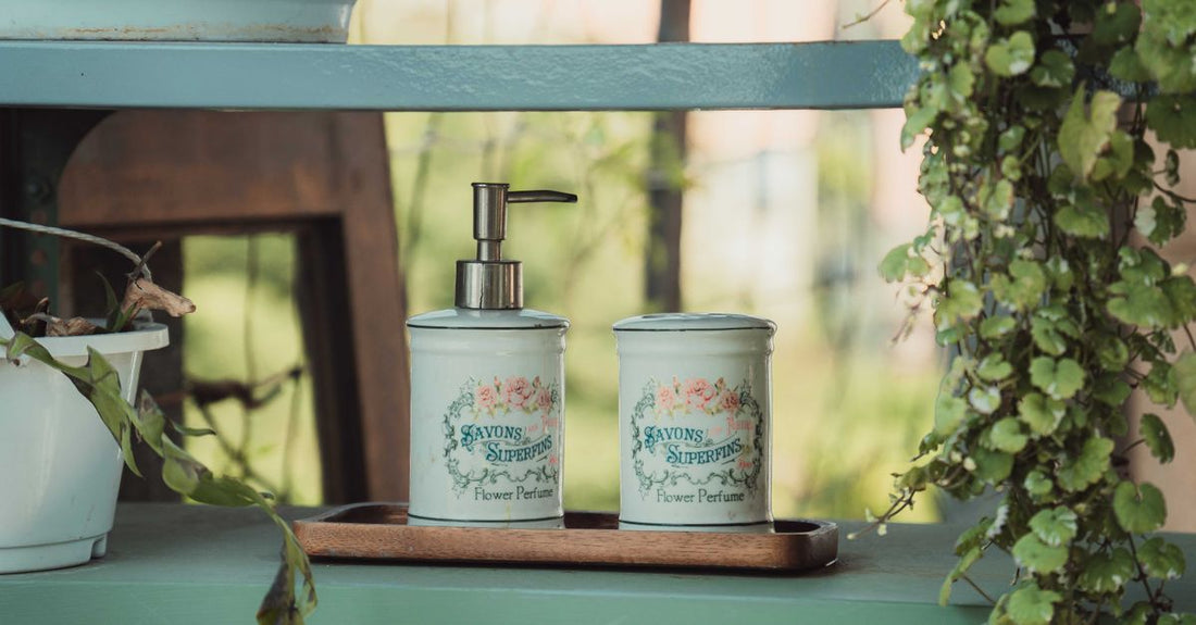 Colour-safe shampoo and conditioner bottles on a bathroom shelf, illustrating how to care for colour treated hair at home.