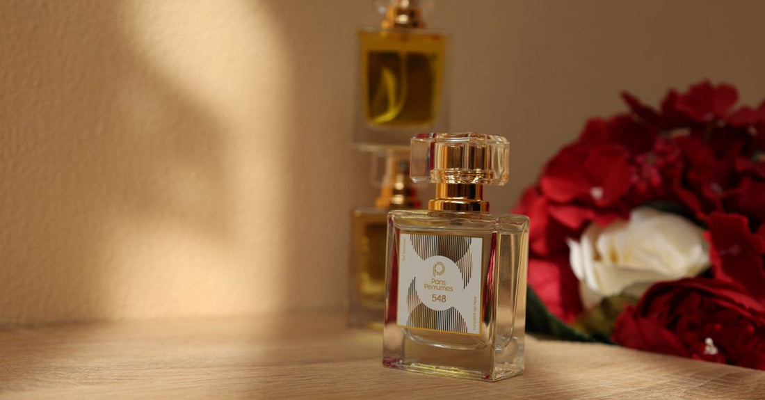 A selection of perfume and cologne bottles on a marble surface, illustrating the difference between eau de parfum and cologne concentrations.