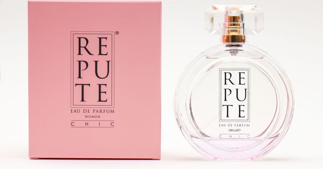 A collection of best body sprays 2026 bottles displayed on a light marble surface, showcasing elegant packaging and colourful liquids.