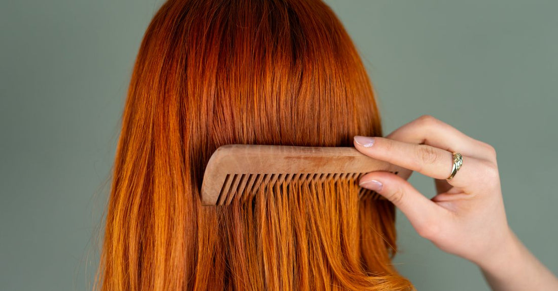 A wooden beard and mustache comb set on a grooming table, part of the best beard & mustache combs 2026 selection