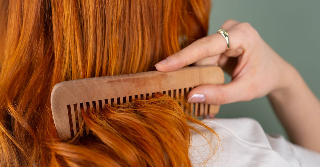 Detangling brush gliding through wet hair without breakage, demonstrating how to detangle hair gently