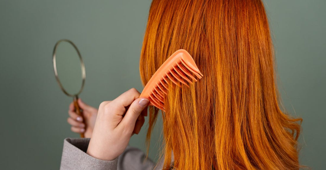 Assorted dry shampoo bottles and powder tins arranged on a light surface, illustrating how to choose dry shampoos for different hair types.
