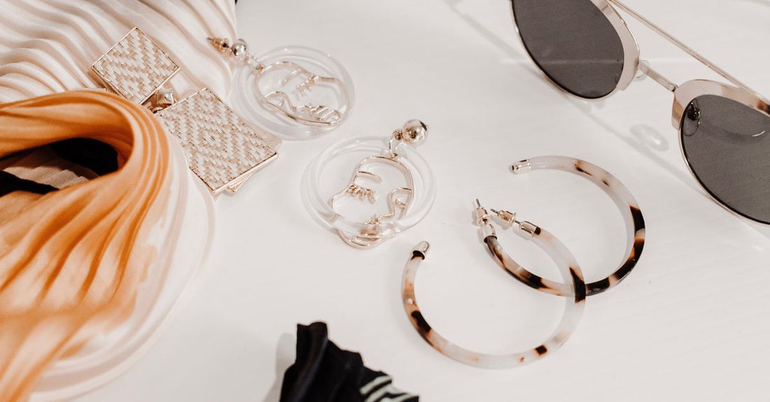 A flatlay of various hair pins including bobby pins, French pins and pearl forks on a neutral background, illustrating the best hair pins 2026 range.