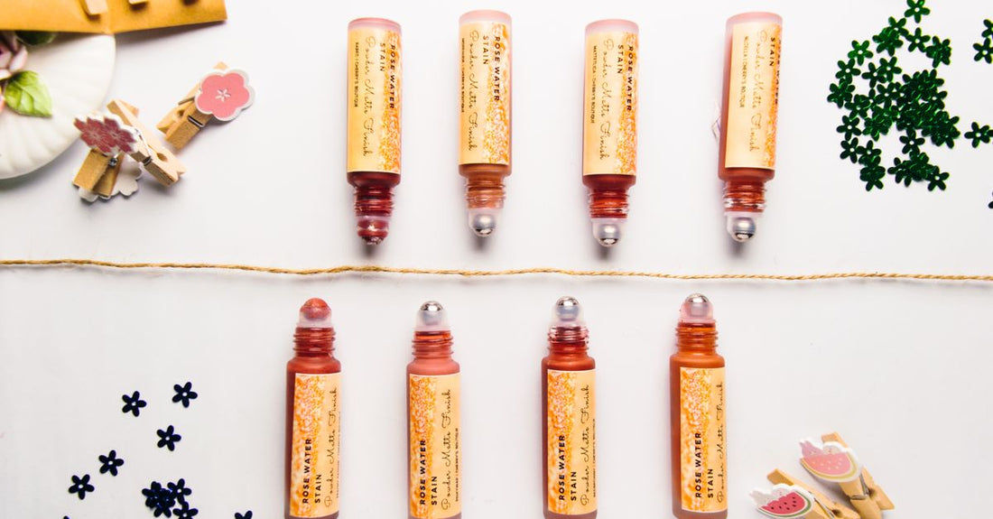 A flatlay of assorted hair rollers including foam, velcro, and flexi rods on a neutral background, illustrating the best hair rollers 2026.