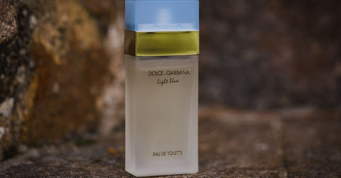 A selection of eau de toilette bottles on a marble surface, illustrating how to choose eau de toilette UK styles.