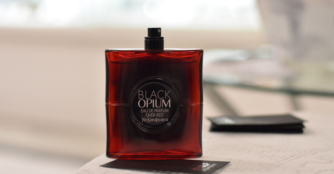 A glass cologne bottle on a desk, representing how to choose cologne for daily wear