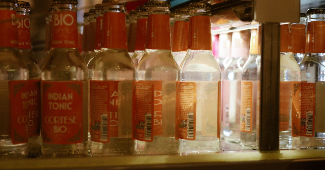 A selection of hair tonic bottles displayed on a bathroom shelf, illustrating how to choose hair tonics UK for different scalp needs.