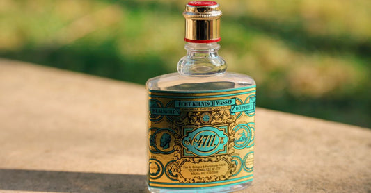 Selection of best cologne for men UK 2026 bottles on a marble surface, representing expert-recommended fragrances for every budget.