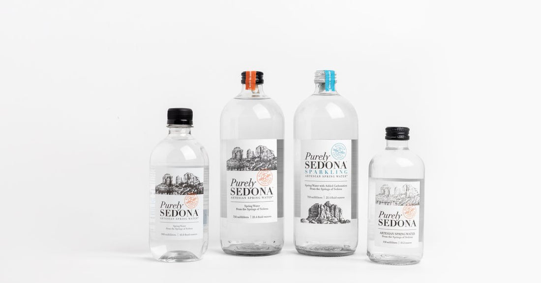 Bottle of micellar water next to white cotton pads on a clean surface, demonstrating how to use micellar water.