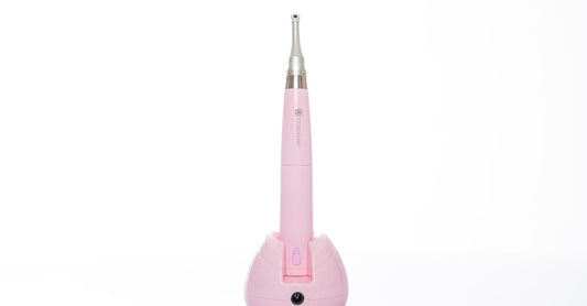 A sleek white microdermabrasion device with diamond tip and LED display, part of our microdermabrasion devices buying guide.