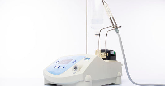 A sleek white microdermabrasion device with a diamond tip, on a clean white background, representing how to choose microdermabrasion devices for UK shoppers.