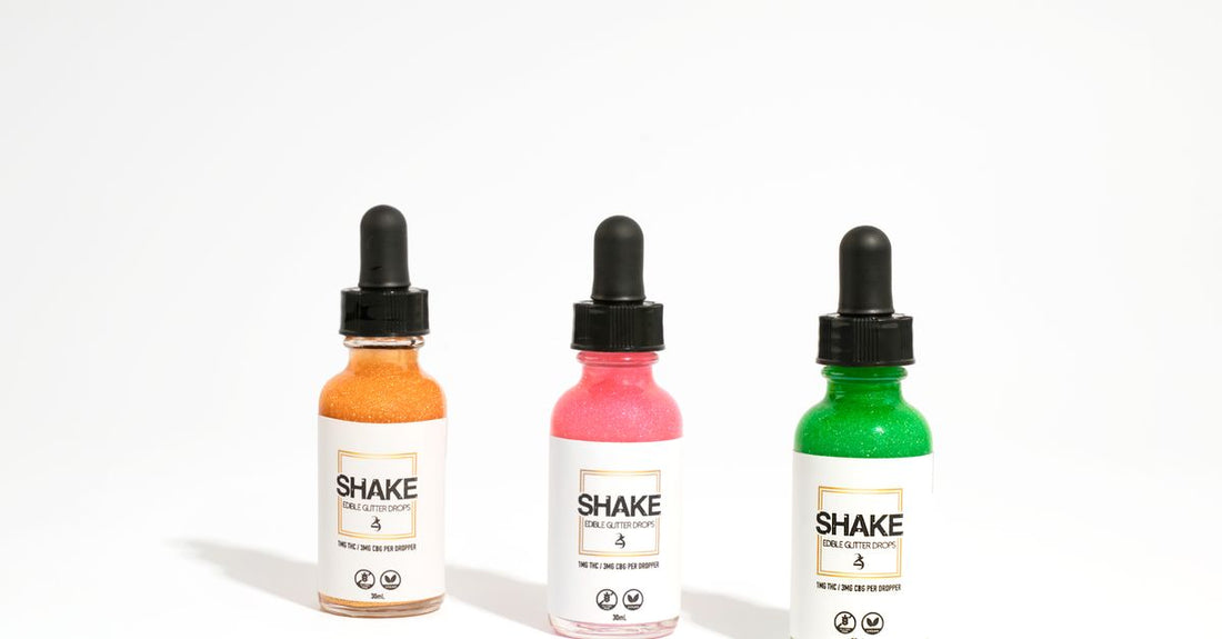 A bottle of facial self-tanning bronzing drops next to a skincare serum, for a facial self tanners buying guide.