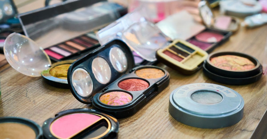 A compact all-in-one makeup palette with mirror, eyeshadows, blush, and bronzer, ideal for travel, representing the best makeup palette for travel UK
