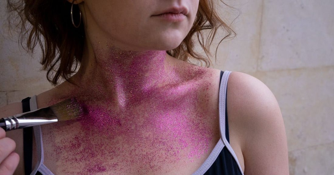 A collection of body glitter products including sprays and gels on a white background, showcasing the best body glitter 2026 options.