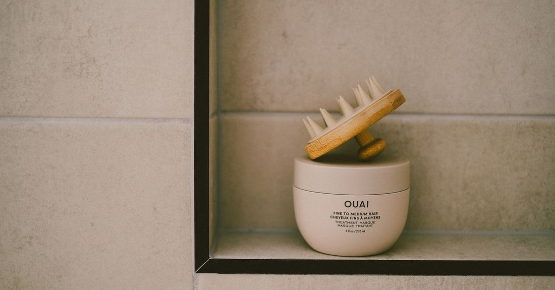 A row of deep conditioner jars and bottles on a bathroom shelf in the UK, showing how to choose deep conditioners for different hair types.