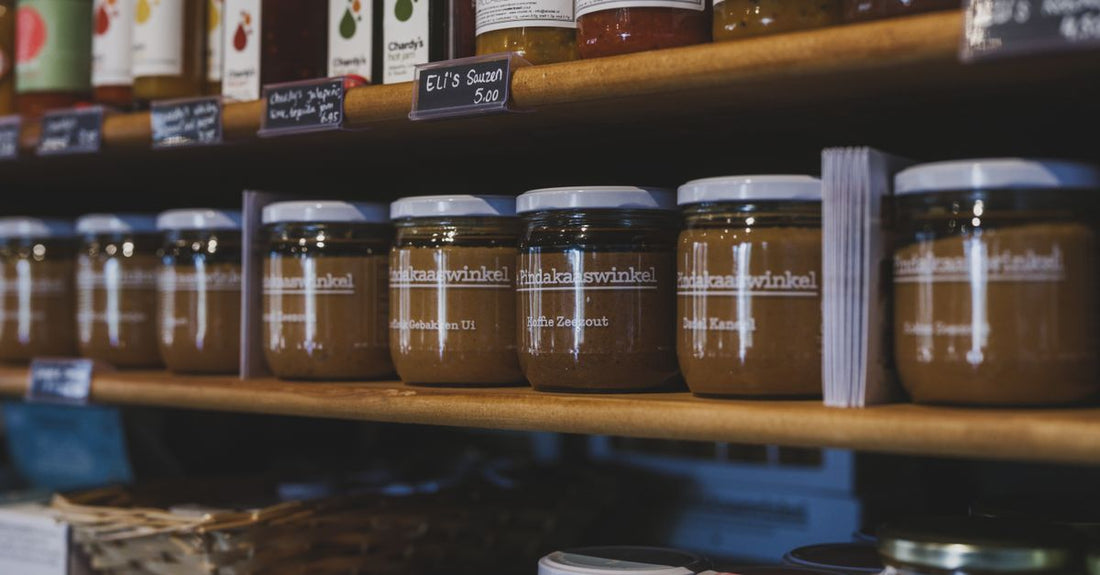 Assorted jars of whipped body butter on a shelf, illustrating how to choose body butters UK