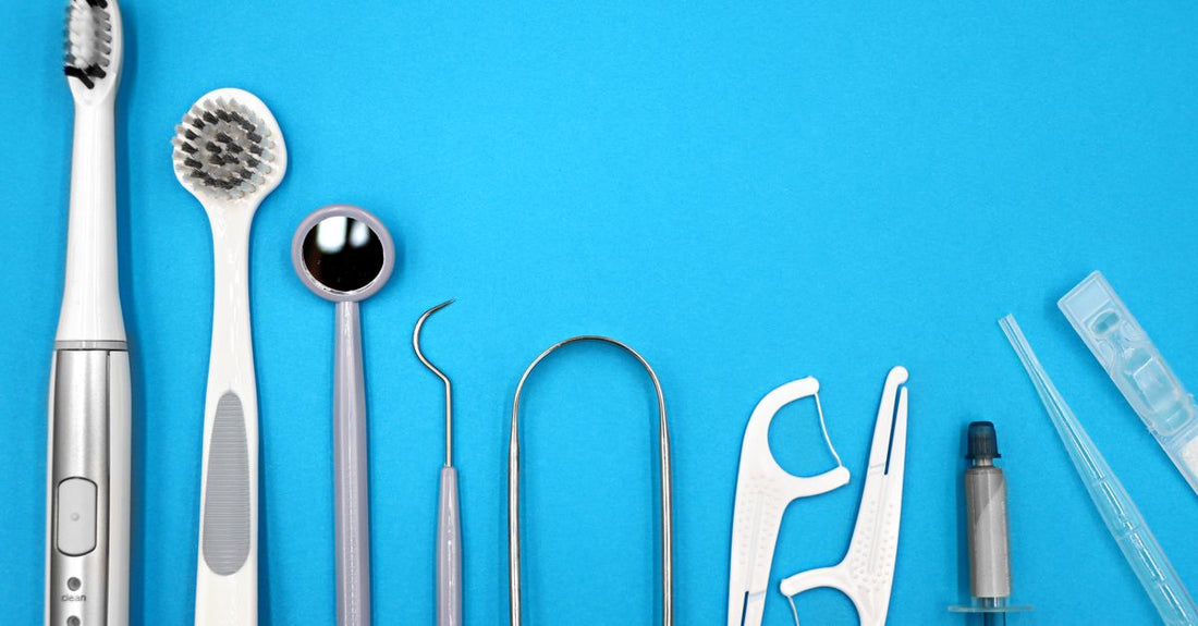 Natural teeth whitening kit on a bathroom shelf with bamboo toothbrush and charcoal powder