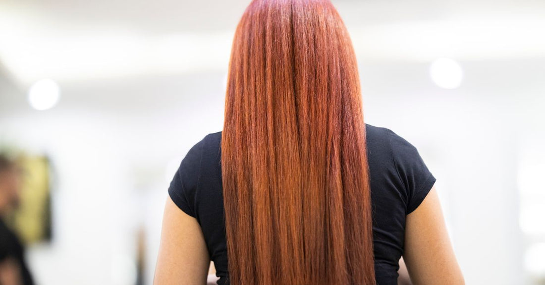 Professional keratin straightening kit for best chemical hair straighteners 2026, displayed on a light bathroom shelf.