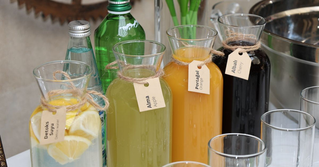 A selection of body self-tanner bottles and tubes arranged on a light surface, showcasing different formulas for a body self-tanners buying guide.