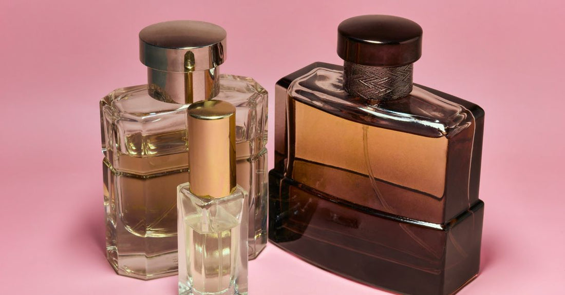 A flatlay of various eau de toilette bottles on a neutral background, illustrating an eau de toilette buying guide UK for 2026.