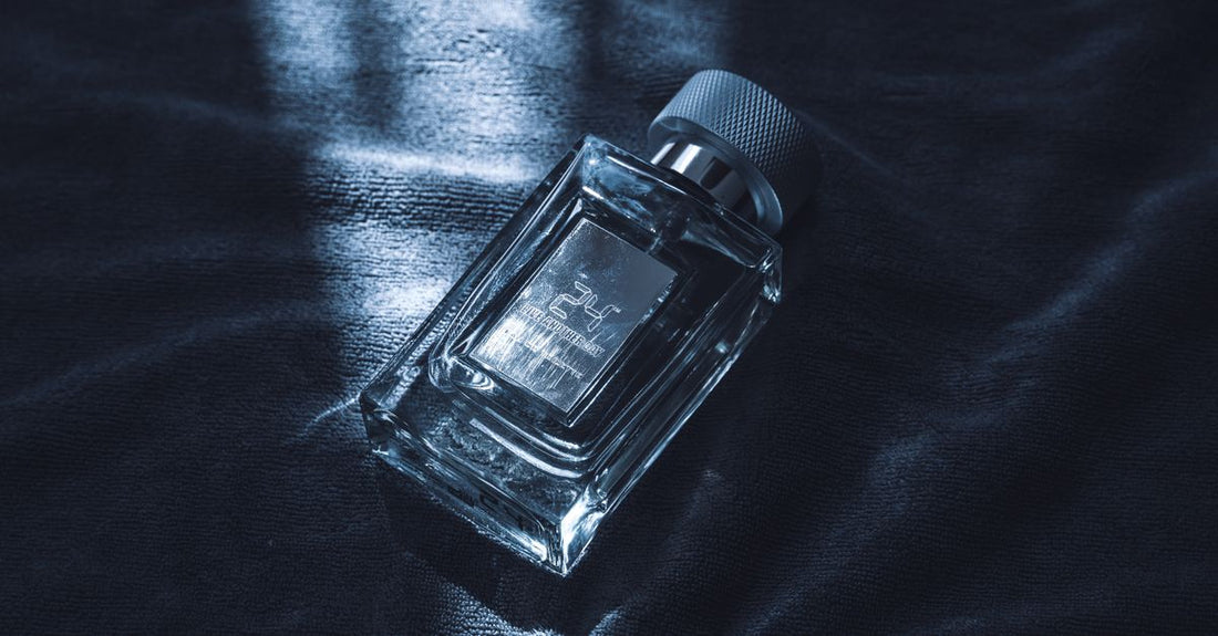 A selection of body spray bottles arranged on a light surface, illustrating a body sprays buying guide for UK shoppers.