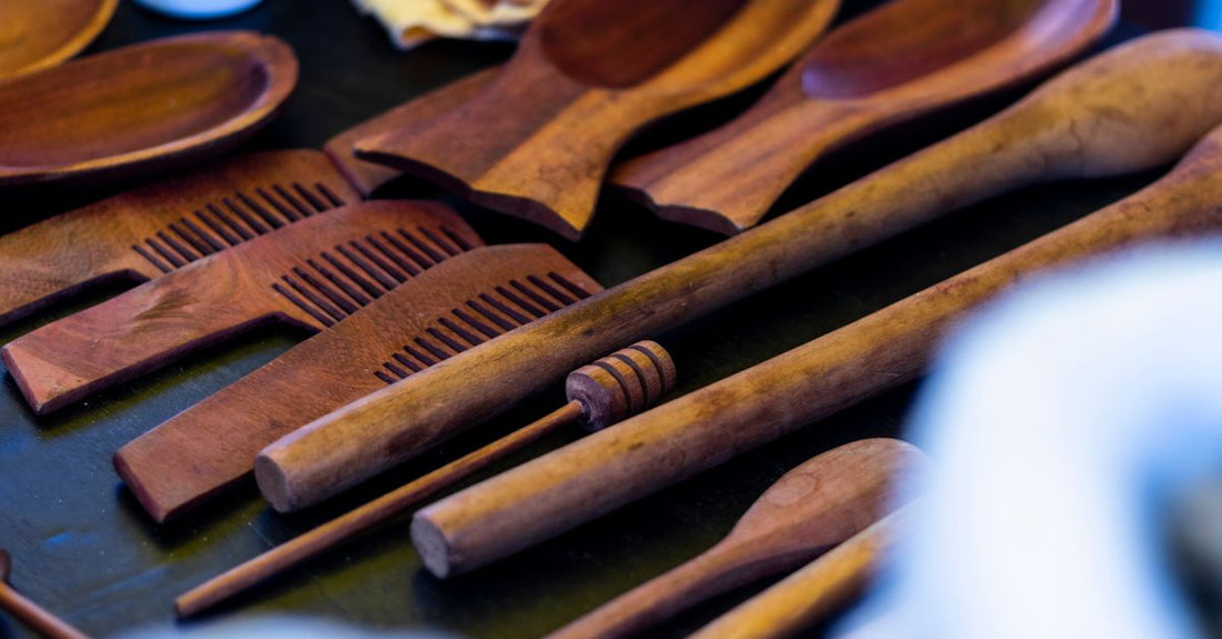 Wooden hair comb set lying flat on a light surface, showing wide and fine teeth, featured in a hair combs buying guide.