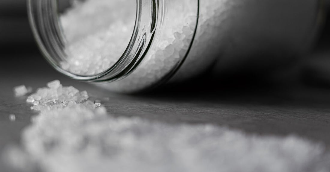 A selection of bath salts in glass jars, illustrating how to choose bath salts UK for your ideal soak routine.