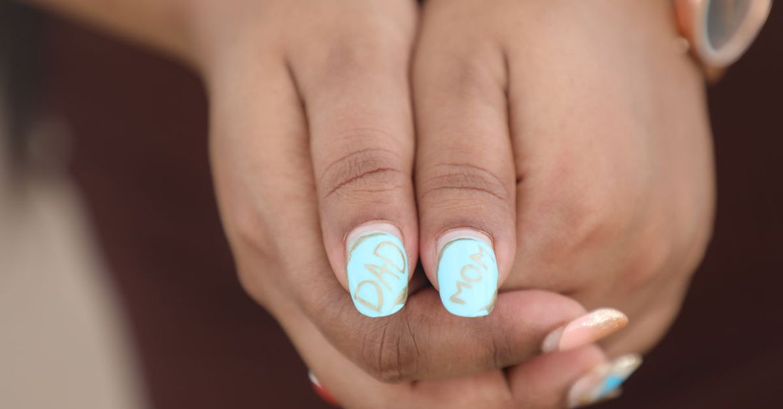 A selection of the best nail art accessories 2026 including stampers, dotting pens, and stencils on a white background.
