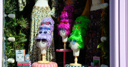 A collection of hairpieces displayed on wig stands, illustrating options for how to choose hairpieces UK.