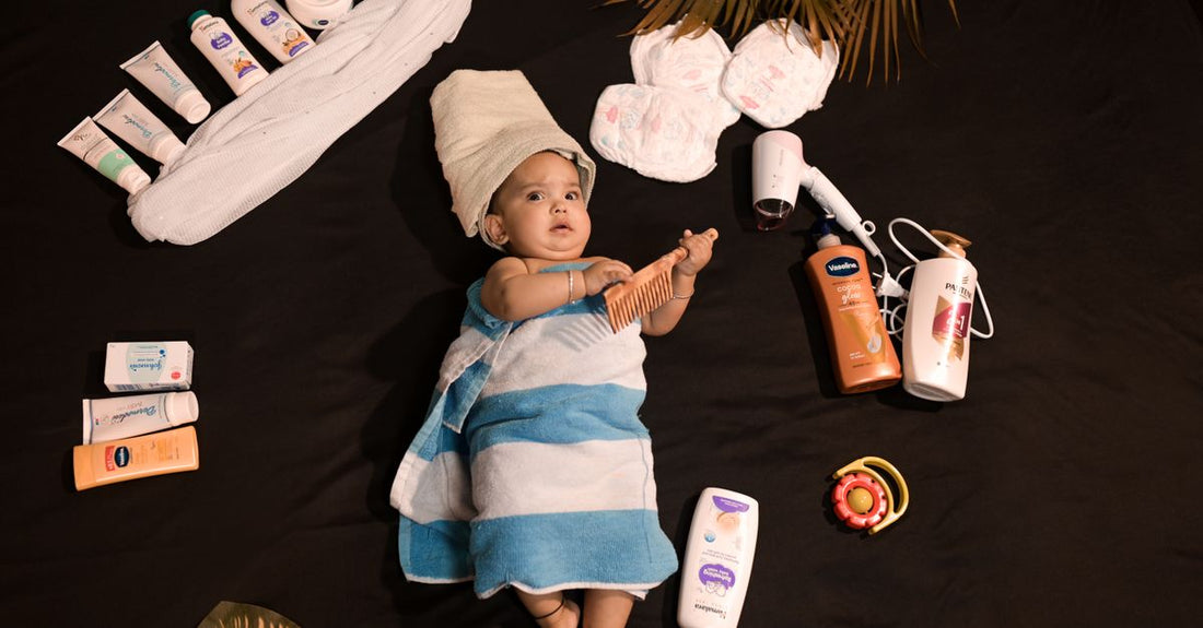 A flatlay of baby & child care essentials like a soft brush, nail clippers, and gentle wash on a neutral surface, illustrating a thoughtful buying guide approach.