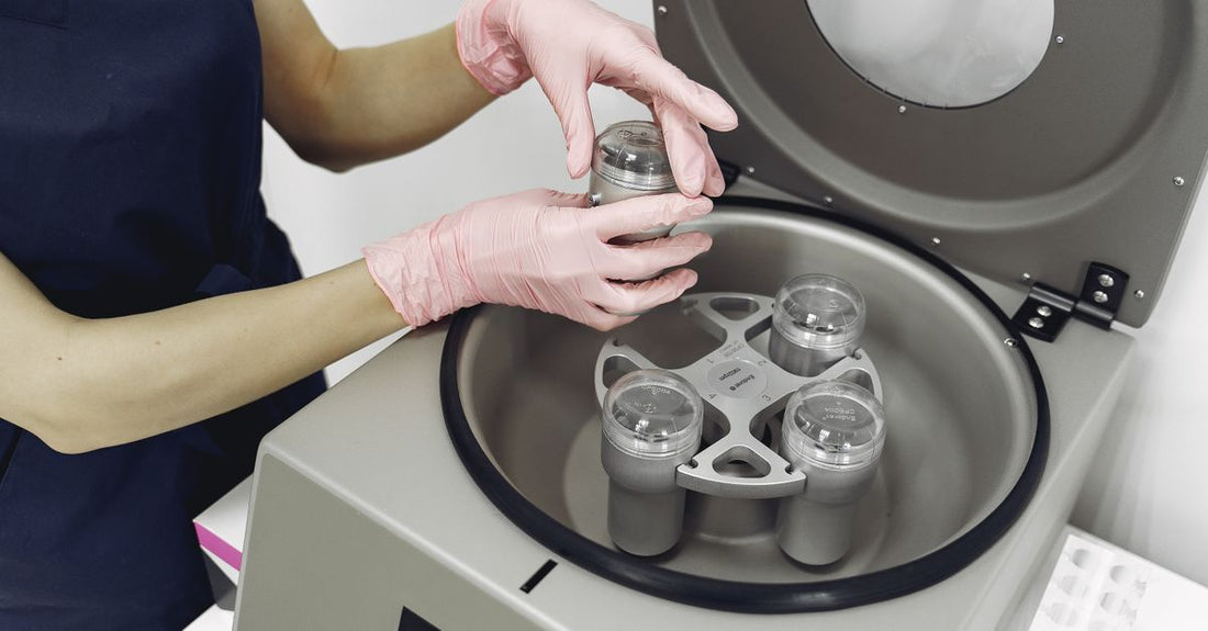 Three white jars of best face moisturizers 2026 on a clean laboratory bench with data charts