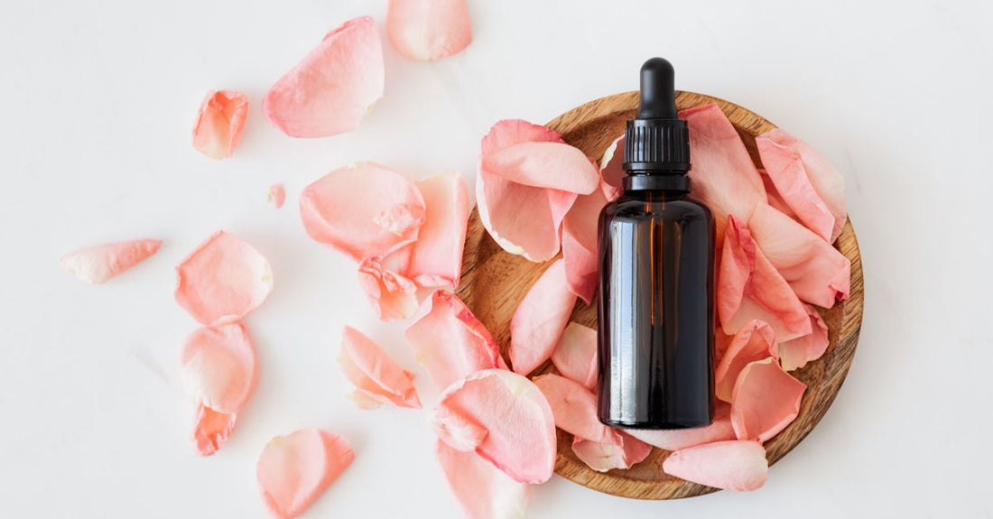 Selection of flower essence bottles on a natural surface, illustrating how to choose flower essences for emotional wellbeing