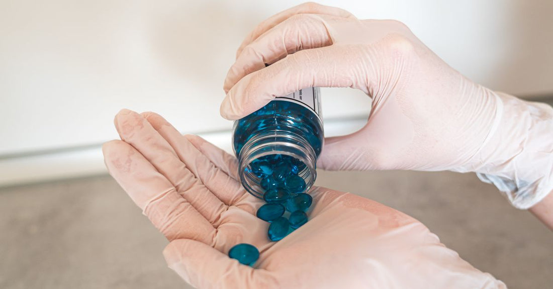 A bottle of liquid latex cuticle protector on a white background, used for a cuticle protectors buying guide.
