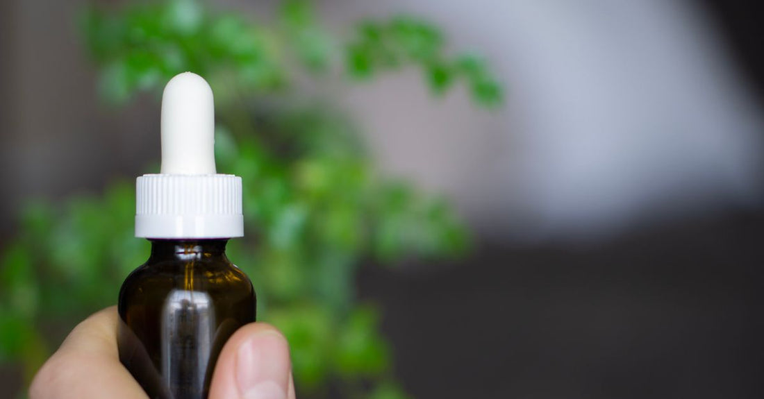 Hair oil bottle on a clean surface, demonstrating how to use hair oil for shine