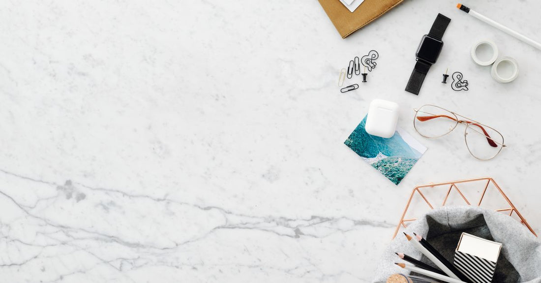 Eau de parfum buying guide featuring a luxury fragrance bottle on a marble surface, representing the perfect daily scent routine for UK shoppers.