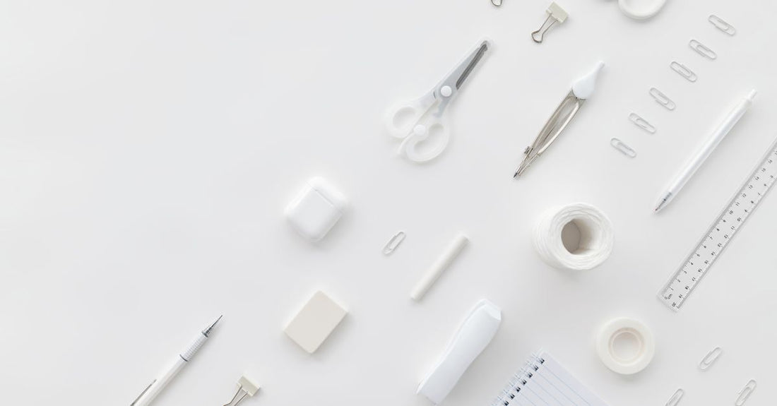 A curated flatlay of premium beauty and skincare accessories on a white marble surface, showcasing the best accessories 2026 for UK shoppers.