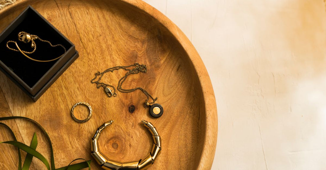 A flatlay of various hair clips including barrettes, jaw clips, and alligator clips on a neutral background.