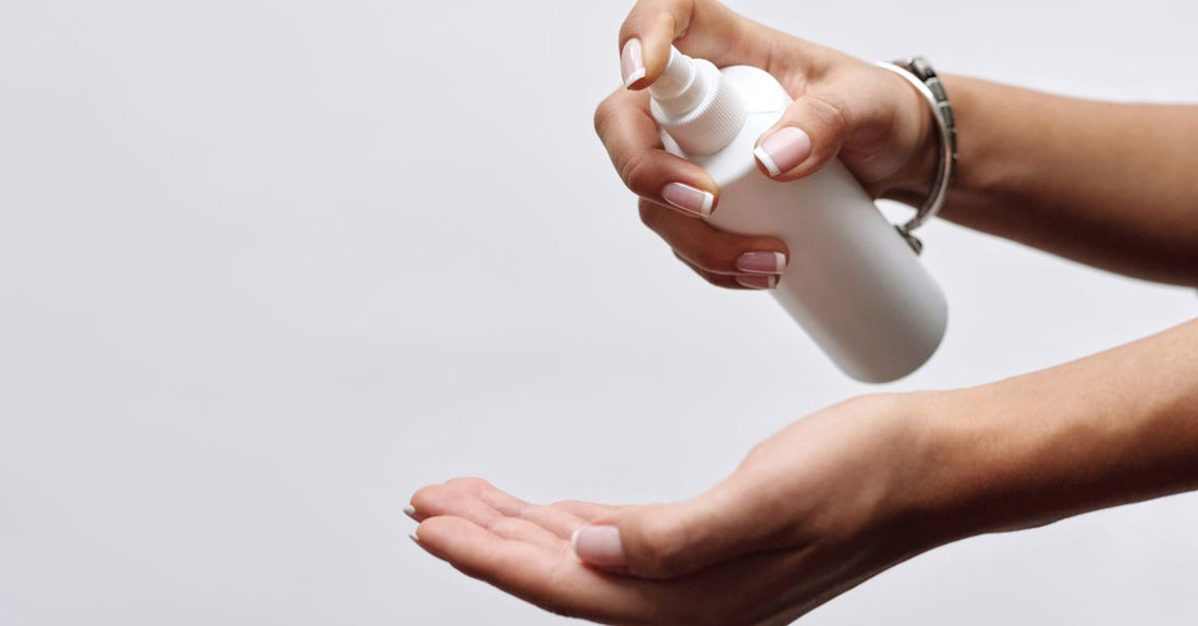 How to use heat protectant spray bottle on a white background for hair protection and styling