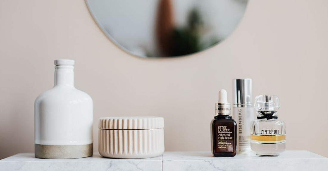 Hair serum bottle on a marble surface, representing how to use hair serum for smoothness