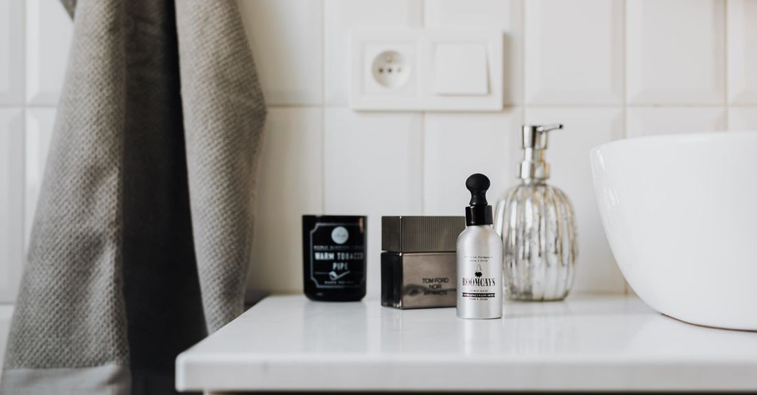 A selection of luxury body wash bottles on a marble surface, representing our body washes buying guide recommendations.