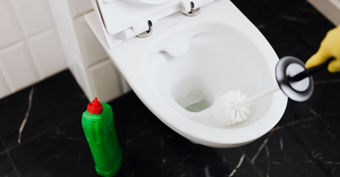 A selection of deodorant sticks and creams on a bathroom shelf, illustrating how to choose deodorant for different skin types.