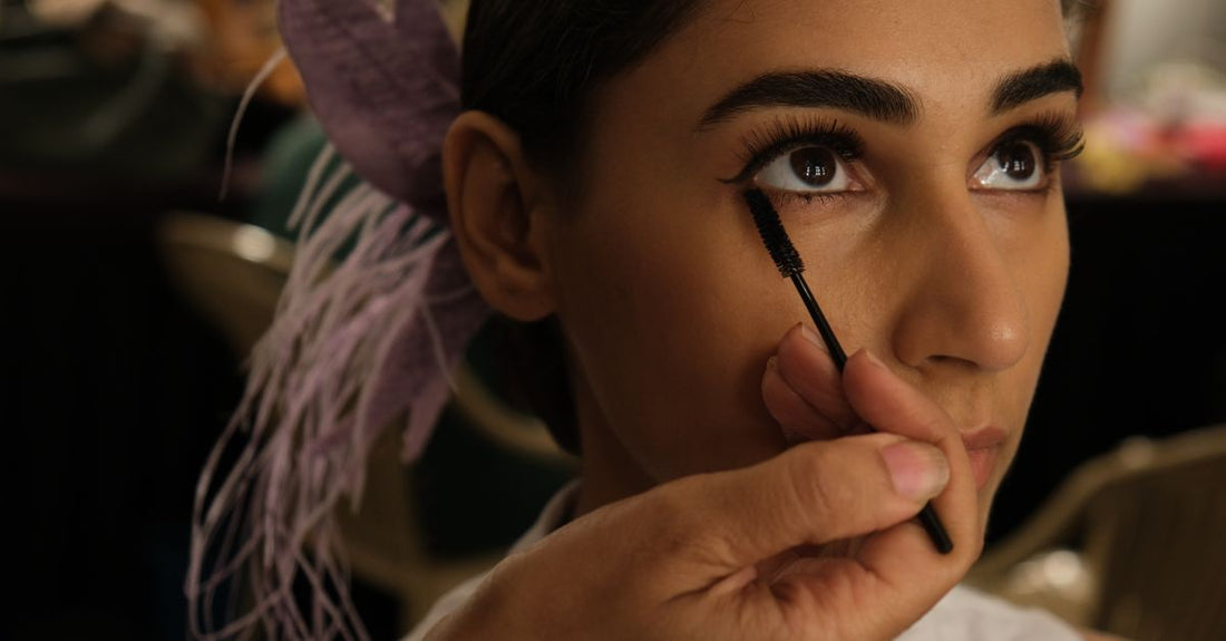 Mascara buying guide featuring four mascara tubes in a clean flatlay on a white surface, illustrating routine integration for UK beauty shoppers.