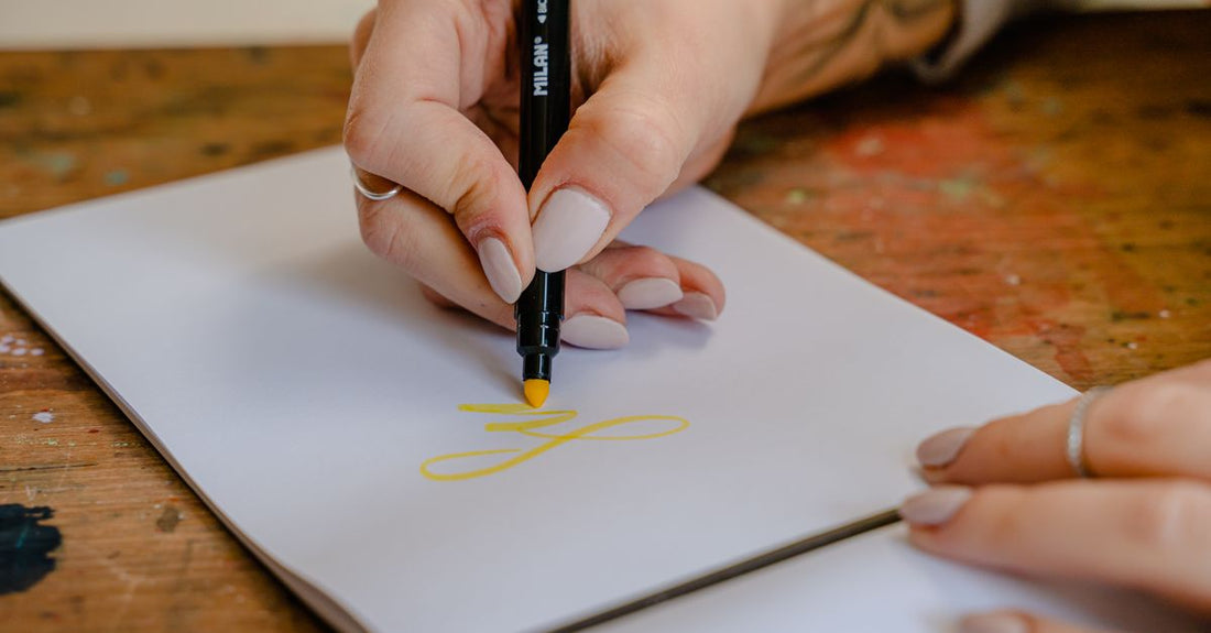 Nail art pens buying guide featuring a set of fine-tip nail art pens on a white surface
