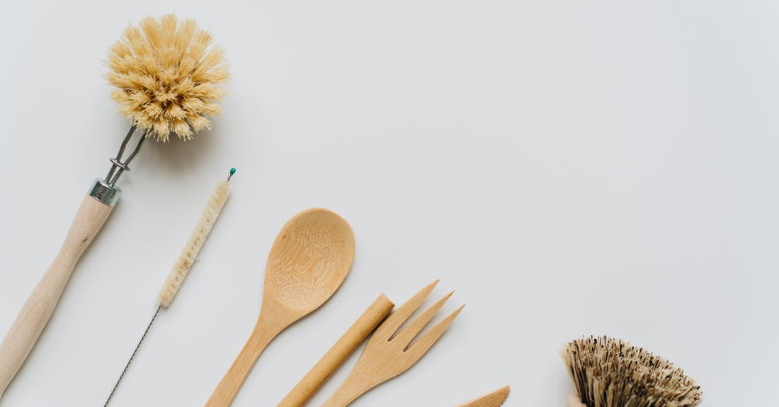 A collection of best cleaning equipment 2026 items including brushes, sprays, and microfibre cloths arranged neatly on a light surface.