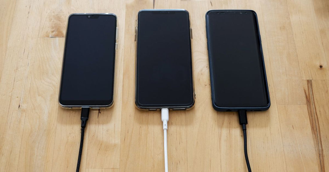 Flatlay of various shaver charger cables and protective cases on a light background, illustrating how to choose accessories for grooming devices.