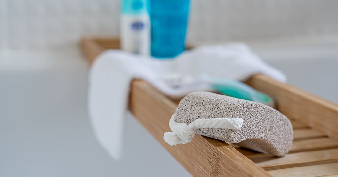 A foot file resting on a bathroom shelf alongside pedicure tools, ready for use in a smooth feet routine.