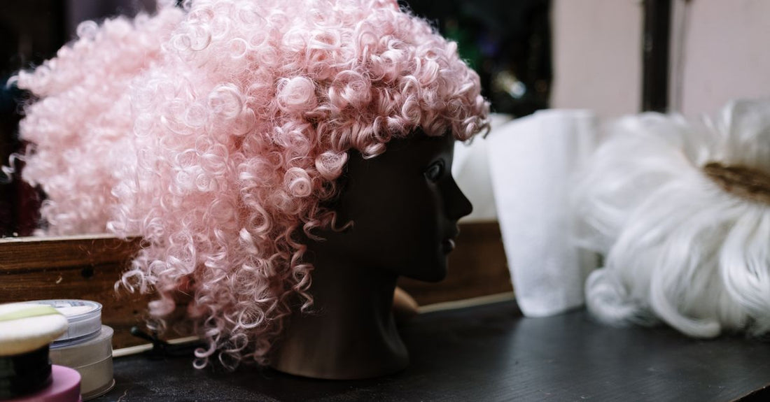 A natural-looking synthetic wig displayed on a mannequin head, demonstrating how to choose wigs UK for realistic appearance and comfort.