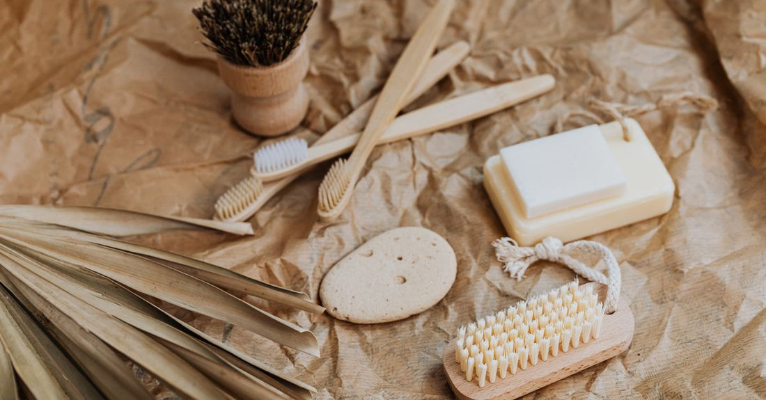 A natural grey pumice stone lying on a white bathroom shelf, representing how to choose foot pumices for effective callus removal.